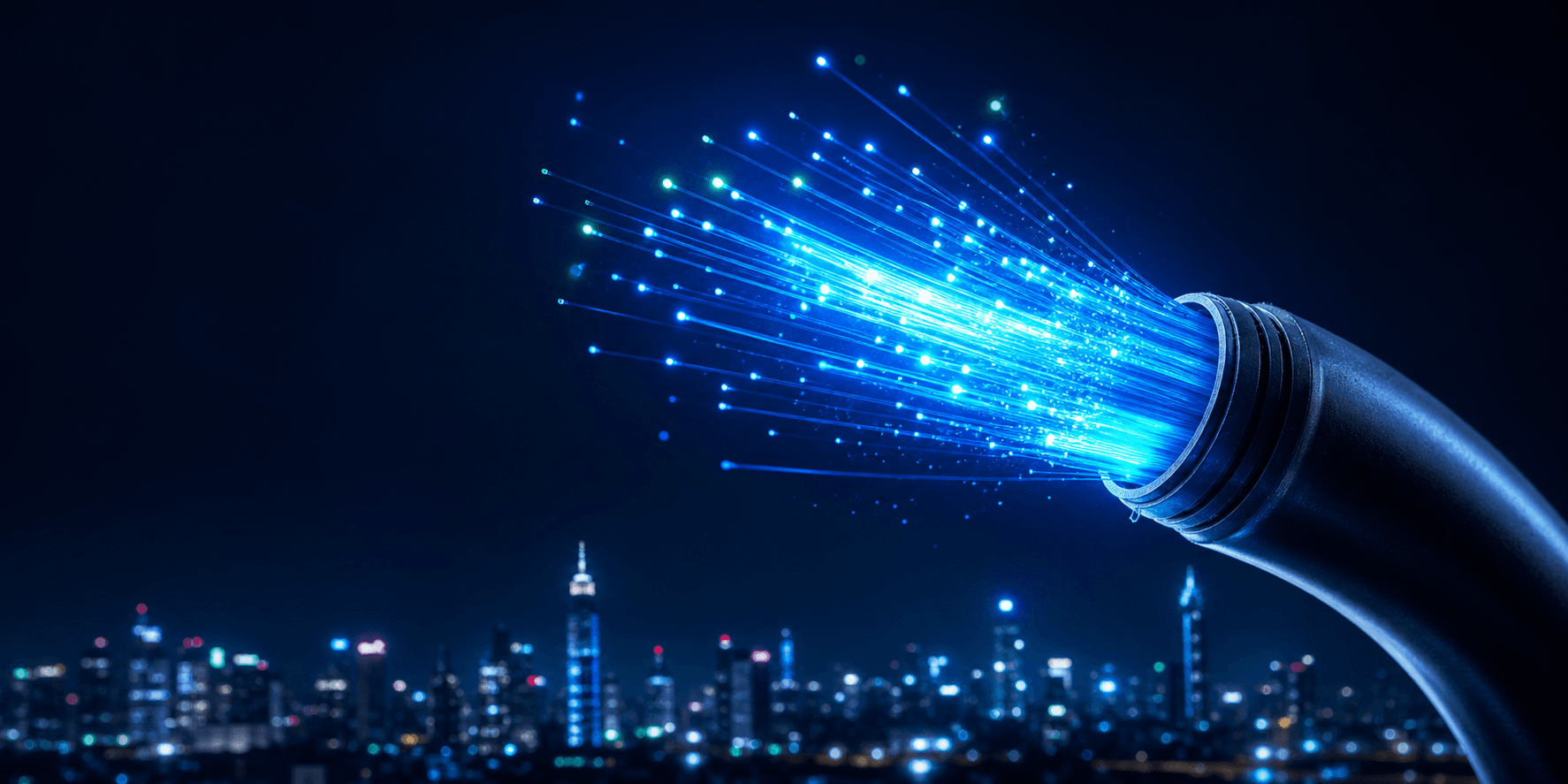 Glowing fiber optic cable over a city at night
